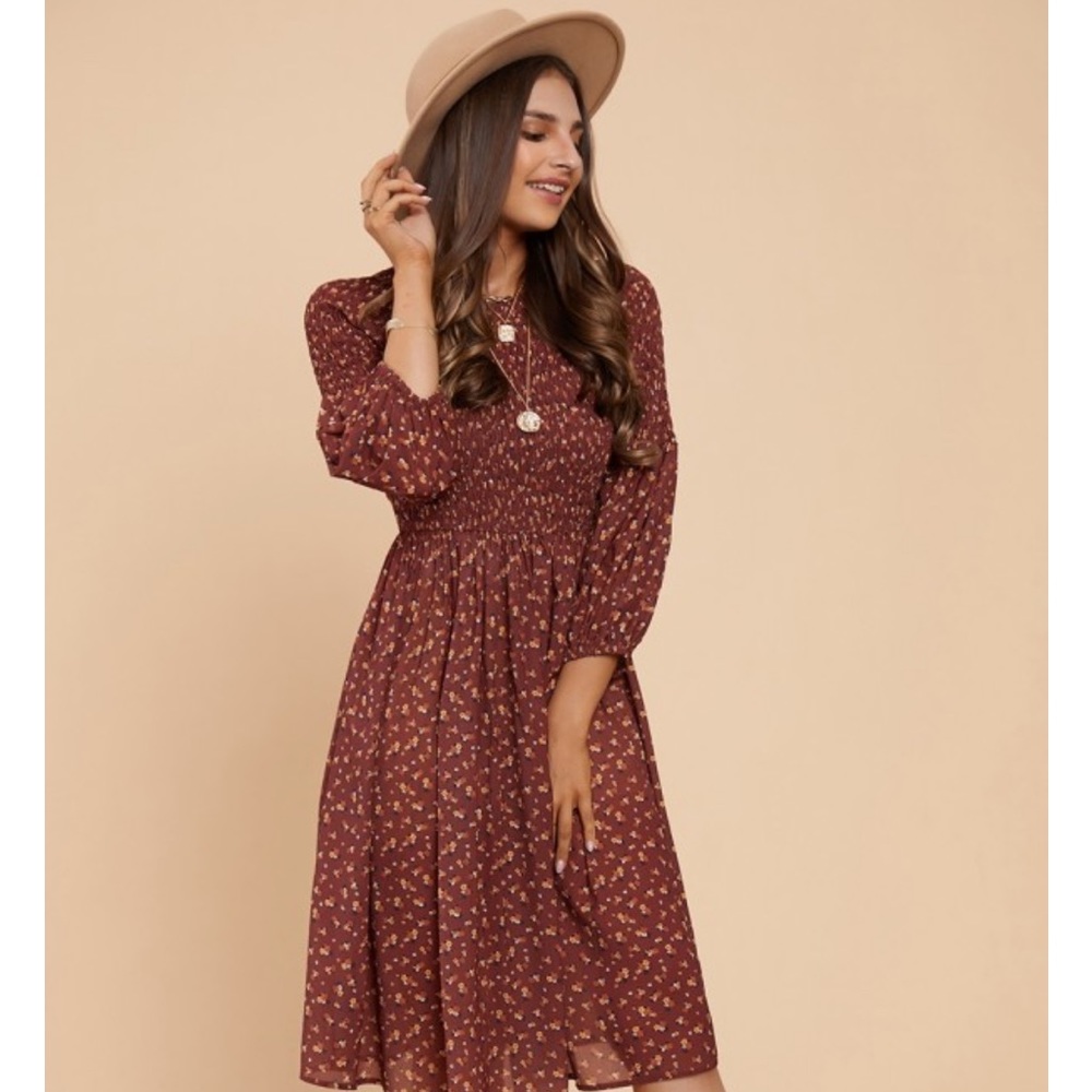 Red brown dress with floral pattern and smocked top. Like new, worn only once